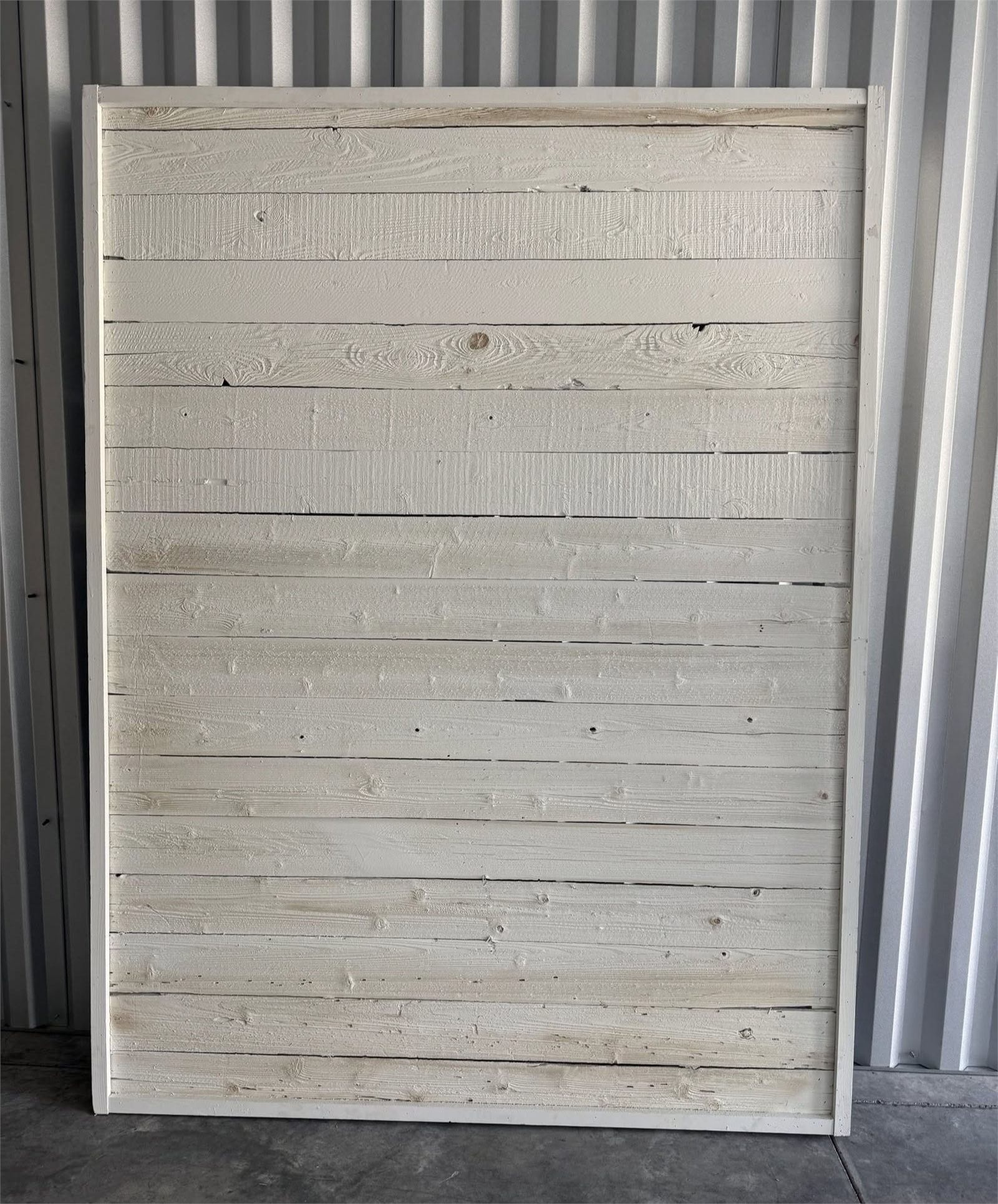 The reverse of the barnwood backdrop, painted white